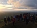 The congregation bathed in the light of the rising sun